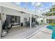 Covered patio featuring ample seating, a ceiling fan, and access to the pool area at 1205 Weeping Willow Dr, Deland, FL 32724