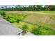 Expansive backyard featuring lush green grass, an iron fence, and backing up to a scenic golf course at 1227 Victoria Hills N Dr, Deland, FL 32724