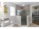 Updated bathroom featuring glass shower, granite counter, and stylish gray tile at 1227 Victoria Hills N Dr, Deland, FL 32724