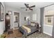 Bedroom featuring ceiling fan, natural light, and view into adjacent bathroom at 1227 Victoria Hills N Dr, Deland, FL 32724