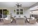 Inviting covered patio with comfortable seating and stylish outdoor decor at 1227 Victoria Hills N Dr, Deland, FL 32724