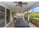 Charming covered patio with an outdoor dining area and comfortable seating at 1227 Victoria Hills N Dr, Deland, FL 32724