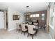 Formal dining area with stylish light fixture, seating for six, and neutral color scheme at 1227 Victoria Hills N Dr, Deland, FL 32724