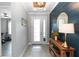 Inviting foyer with stylish decor, a wooden console table, and a view into other rooms at 1227 Victoria Hills N Dr, Deland, FL 32724