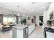 Spacious kitchen with a granite island open to the living room and outdoor patio at 1227 Victoria Hills N Dr, Deland, FL 32724