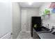 Spacious laundry room with washer, dryer, refrigerator, and ample shelving at 1227 Victoria Hills N Dr, Deland, FL 32724