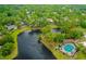 Aerial view featuring a lake, mature trees and pool at 127 Cypress Pond Rd, Port Orange, FL 32128
