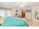 Airy bedroom with a closet and a calming color scheme, featuring ample storage and access to the en-suite bathroom at 127 Cypress Pond Rd, Port Orange, FL 32128