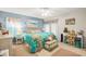 Coastal-themed bedroom with turquoise accents, beachy decor, and natural light, creating a serene and inviting retreat at 127 Cypress Pond Rd, Port Orange, FL 32128