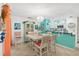 Bright dining area with charming china cabinet, chandelier, adjacent to a cozy kitchen space at 127 Cypress Pond Rd, Port Orange, FL 32128