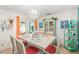Bright dining room with French doors, decorative china cabinet, and matching white table and chairs at 127 Cypress Pond Rd, Port Orange, FL 32128