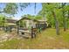 Charming home featuring a quaint front yard, lovely garden, and an inviting, decorative fence enhancing its curb appeal at 127 Cypress Pond Rd, Port Orange, FL 32128