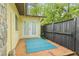 Private patio area with double doors and a blue rug, perfect for outdoor seating and relaxation at 127 Cypress Pond Rd, Port Orange, FL 32128