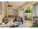 Sun Room needing TLC with door leading to the backyard at 127 Cypress Pond Rd, Port Orange, FL 32128