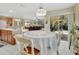 Bright dining area with table, chairs and sliding glass doors to outside at 1310 Pup Fish Ln, Deland, FL 32724
