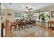Spacious dining room with a ceiling fan and windows with blinds at 1310 Pup Fish Ln, Deland, FL 32724