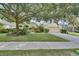 Charming single-story home with lush landscaping and a two-car garage at 1310 Pup Fish Ln, Deland, FL 32724