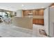 Spacious kitchen features tiled floors, wood cabinetry, and connects to a sunlit dining area at 1310 Pup Fish Ln, Deland, FL 32724