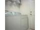 Practical laundry area featuring a white washer and dryer set at 1310 Pup Fish Ln, Deland, FL 32724