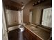 A bathroom featuring a vanity, mirror, tub with tile surround, and toilet at 1370 19Th St, Orange City, FL 32763