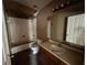 A bathroom featuring a vanity, mirror, tub with tile surround, and toilet at 1370 19Th St, Orange City, FL 32763