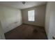 An empty bedroom with a window at 1370 19Th St, Orange City, FL 32763
