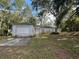 A single-Gathering home featuring an attached one-car garage and a front yard with mature trees at 1370 19Th St, Orange City, FL 32763
