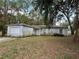 A single-Gathering home featuring an attached one-car garage and a front yard with mature trees at 1370 19Th St, Orange City, FL 32763