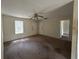 The living room includes a ceiling fan and standard windows at 1370 19Th St, Orange City, FL 32763