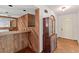 Inviting entryway with a wood accent bar, and a vintage china cabinet at 1411 N Beach St, Ormond Beach, FL 32174