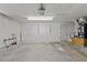 Clean, spacious garage with a roll-up door, ample storage, and access door to the house at 1411 N Beach St, Ormond Beach, FL 32174