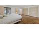 Bright main bedroom with ample closet space, sliding glass doors to the patio and ensuite bathroom at 1411 N Beach St, Ormond Beach, FL 32174