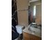 Bathroom with modern fixtures, a commode, and a vanity sink at 1556 Ferendina Dr, Deltona, FL 32725