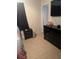 Bedroom featuring a TV on the wall, neutral colored walls, tile flooring, and lots of dresser storage at 1556 Ferendina Dr, Deltona, FL 32725