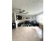 Open-concept living room featuring lots of space, tile flooring, a ceiling fan, and plenty of light at 1556 Ferendina Dr, Deltona, FL 32725