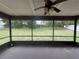 Screened in back porch with views of the green, open backyard at 1556 Ferendina Dr, Deltona, FL 32725