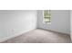 Bedroom featuring carpeted floors and a window at 1683 10Th Ave, Deland, FL 32724