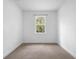 Empty bedroom featuring a window and neutral carpeting at 1683 10Th Ave, Deland, FL 32724