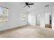 Bright bedroom with two windows, ceiling fan, and a walk-in closet at 1683 10Th Ave, Deland, FL 32724