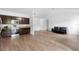 Modern kitchen featuring stainless steel appliances, dark wood cabinetry, granite countertops, and stylish flooring at 1683 10Th Ave, Deland, FL 32724
