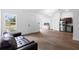 Spacious living area with new vinyl floors, stainless steel appliances, and abundant natural light at 1683 10Th Ave, Deland, FL 32724