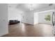 Bright and airy living room featuring clean finishes and durable laminate wood flooring at 1683 10Th Ave, Deland, FL 32724