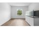 Open living space showcasing laminate floors, white walls and a large picture window at 1683 10Th Ave, Deland, FL 32724