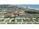 Wide aerial view of a charming coastal community with single-Gathering homes and the beach in the distance at 179 Ann Rustin S Dr, Ormond Beach, FL 32176