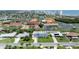 Wide aerial view of a charming coastal community with single-Gathering homes and the beach in the distance at 179 Ann Rustin S Dr, Ormond Beach, FL 32176