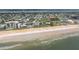 Beautiful aerial view of sandy beach, coastal hotel with a pool, and oceanfront community in a coastal city at 179 Ann Rustin S Dr, Ormond Beach, FL 32176
