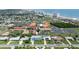 Wide aerial view of a charming coastal community with single-Gathering homes and the beach in the distance at 179 Ann Rustin S Dr, Ormond Beach, FL 32176