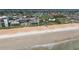 Beautiful aerial view of sandy beach, coastal hotel with a pool, and oceanfront community in a coastal city at 179 Ann Rustin S Dr, Ormond Beach, FL 32176