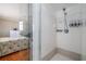 Modern bathroom featuring a glass-enclosed shower, neutral color scheme, and updated fixtures at 179 Ann Rustin S Dr, Ormond Beach, FL 32176