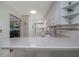 Spacious kitchen with an open layout, featuring white cabinets, stainless steel appliances, and a breakfast bar at 179 Ann Rustin S Dr, Ormond Beach, FL 32176
